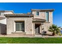 Two-story house with light-colored exterior, landscaping, and a two-car garage at 8478 W Lewis Ave, Phoenix, AZ 85037