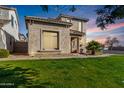 Two-story home with front yard and walkway at 8478 W Lewis Ave, Phoenix, AZ 85037