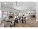 Bright living room with fireplace, hardwood floors and access to backyard at 9447 W Tonto Ln, Peoria, AZ 85382
