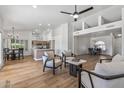 Open concept living space with hardwood floors and kitchen views at 9447 W Tonto Ln, Peoria, AZ 85382