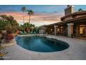 Inviting kidney-shaped pool with a waterfall feature at 10190 E Sunnyside Dr, Scottsdale, AZ 85260