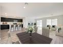 Open concept dining area with kitchen and living room views at 1344 W Inca Dr, Coolidge, AZ 85128