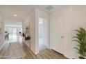 Bright and spacious entryway with wood-look flooring and view to living area at 1344 W Inca Dr, Coolidge, AZ 85128