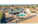 House with a kidney-shaped pool and large backyard at 1363 N Terripin St, Mesa, AZ 85207