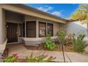 Inviting front entrance with a walkway and well-maintained landscaping at 1427 E Irwin Ave, Phoenix, AZ 85042