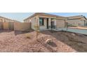 Single-story house with attached garage and rocky front yard at 17449 W El Caminito Dr, Waddell, AZ 85355