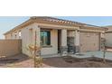 New construction home with neutral color palette and stone accents at 17449 W El Caminito Dr, Waddell, AZ 85355