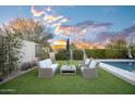 Relaxing poolside patio furniture with mountain views at 18391 N 97Th Pl, Scottsdale, AZ 85255