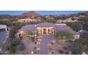 Stunning desert home with a tile roof, stone accents, and a landscaped yard at 26475 N 106Th Way, Scottsdale, AZ 85255