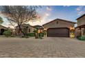 Tuscan style home with a two car garage and paved driveway at 3172 S Mulberry Ct, Gold Canyon, AZ 85118