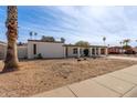 Single-story house with carport and landscaped yard at 3801 W Mercer Ln, Phoenix, AZ 85029