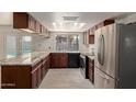 Spacious kitchen with granite countertops and stainless steel appliances at 3801 W Mercer Ln, Phoenix, AZ 85029