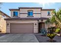 Two story home with attached garage and landscaping at 45707 W Barbara Ln, Maricopa, AZ 85139