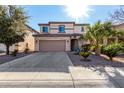 Two story home with attached garage and landscaping at 45707 W Barbara Ln, Maricopa, AZ 85139