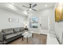 Comfortable living room features stylish sofa, glass coffee table, and ample natural light at 475 N 9Th St # 115, Phoenix, AZ 85006