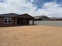 Large backyard with a covered patio, perfect for outdoor entertaining and relaxation at 4807 N 177Th Ln, Goodyear, AZ 85395