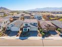 Two-story house, neighborhood view, mountains in background at 5323 W Chuck Box Rd, Laveen, AZ 85339