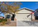 One-story house with a two-car garage and American flag at 10815 S 175Th Dr, Goodyear, AZ 85338