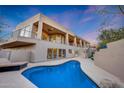 Luxury home with a freeform pool and spacious deck at 12411 N 133Rd Pl, Scottsdale, AZ 85259