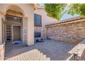 Brick entryway with a double door and paved patio at 12465 N 71St Ave, Peoria, AZ 85381