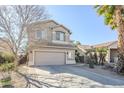 Two-story house with a two-car garage and desert landscaping at 14971 W Desert Hills Dr, Surprise, AZ 85379