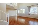 Spacious living room with hardwood floors and high ceilings at 14971 W Desert Hills Dr, Surprise, AZ 85379