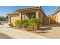 Front view of a house with a two-car garage, landscaping, and walkway at 1840 S Vista Rd, Apache Junction, AZ 85119