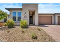 Front entrance of a single-story home with attractive landscaping at 29316 N Lone Pine Ln, Rio Verde, AZ 85263