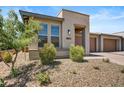 Modern home exterior with drought-tolerant landscaping at 29316 N Lone Pine Ln, Rio Verde, AZ 85263