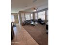 Spacious living room with comfortable seating and large windows at 29316 N Lone Pine Ln, Rio Verde, AZ 85263