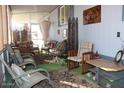 Relaxing screened porch with seating and carpet at 303 S Recker Rd # 113, Mesa, AZ 85206