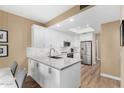 Modern kitchen with white cabinets and stainless steel appliances at 4301 N 21St St # 24, Phoenix, AZ 85016