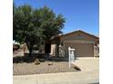 Charming single-story home featuring a well-manicured desert landscape and inviting front porch at 5028 S Peachwood Dr, Gilbert, AZ 85298