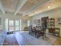 Open dining area with wood floors and large artwork at 6411 S River Dr # 11, Tempe, AZ 85283