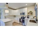 Spacious kitchen with white cabinets and a large island at 6411 S River Dr # 11, Tempe, AZ 85283