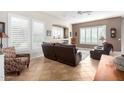 Spacious living room with a fireplace and large windows at 7287 E Sunset Sky Cir, Scottsdale, AZ 85266