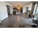 Open kitchen with gray cabinets, a large island, and stainless steel appliances at 10154 W Lawrence Ln, Peoria, AZ 85345