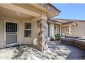Covered entryway with stone pillars and security door at 11360 E Keats Ave # 78, Mesa, AZ 85209