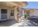 Inviting covered front porch with stone accents, perfect for relaxing outdoors at 11360 E Keats Ave # 78, Mesa, AZ 85209