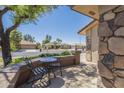 Inviting front porch with an outdoor seating area to enjoy the community view at 11360 E Keats Ave # 78, Mesa, AZ 85209