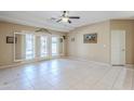 Bright living room with tile floors and French doors to patio at 11360 E Keats Ave # 78, Mesa, AZ 85209