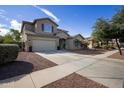 Two-story house with a driveway and landscaping at 11967 W Vernon Ave, Avondale, AZ 85392