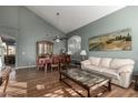 Living room with hardwood floors, off-white couch, and large artwork at 1212 E Butler Dr, Chandler, AZ 85225