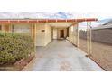 Covered carport with access to the front entrance of the home at 13001 N 111Th Dr, Youngtown, AZ 85363