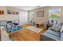 Playroom with hardwood floors, gray couch, and toys at 18611 N 22Nd St # 2, Phoenix, AZ 85024