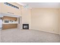 Open living room showcasing a fireplace and high ceilings at 2020 W Union Hills Dr # 201, Phoenix, AZ 85027