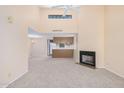 Bright living room with a fireplace and kitchen view at 2020 W Union Hills Dr # 201, Phoenix, AZ 85027