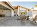 Relaxing patio with seating area, fire pit, and access to garage at 2230 N 87Th Ter, Scottsdale, AZ 85257