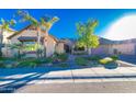 Beautiful house exterior with landscaping and a three car garage at 2835 E Athena Ct, Gilbert, AZ 85297