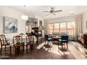 Bright dining room with hardwood floors and a view to the living room at 4324 S Primrose Dr, Gold Canyon, AZ 85118